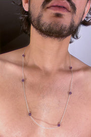 An amethyst bead necklace strung in silver. 